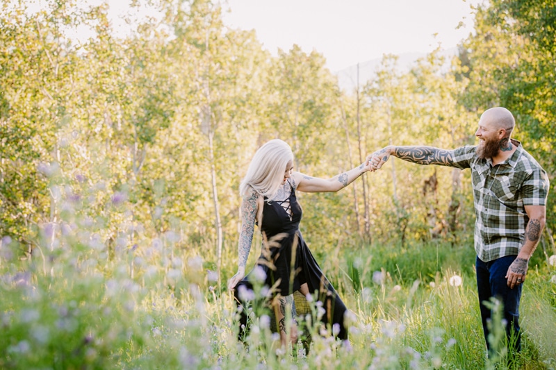 Family Photographer, a man and woman dance in wildflowers