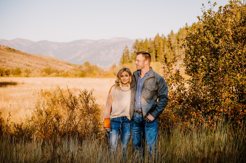 Couples photographer, A man and woman stand together in dry meadows
