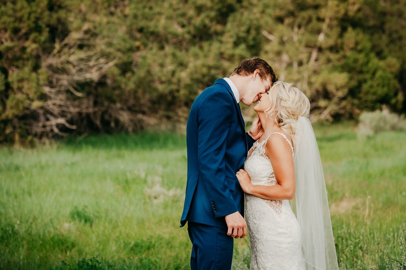 Wedding Photography, a bride and groom kiss on a golf course